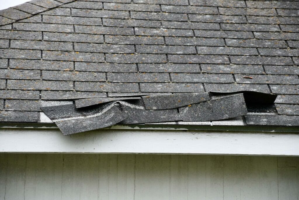 Damaged and torn shingle