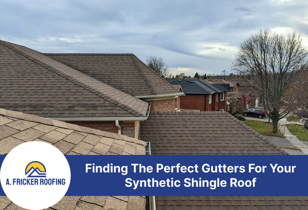 House roof with synthetic shingles and gutters in neighborhood view