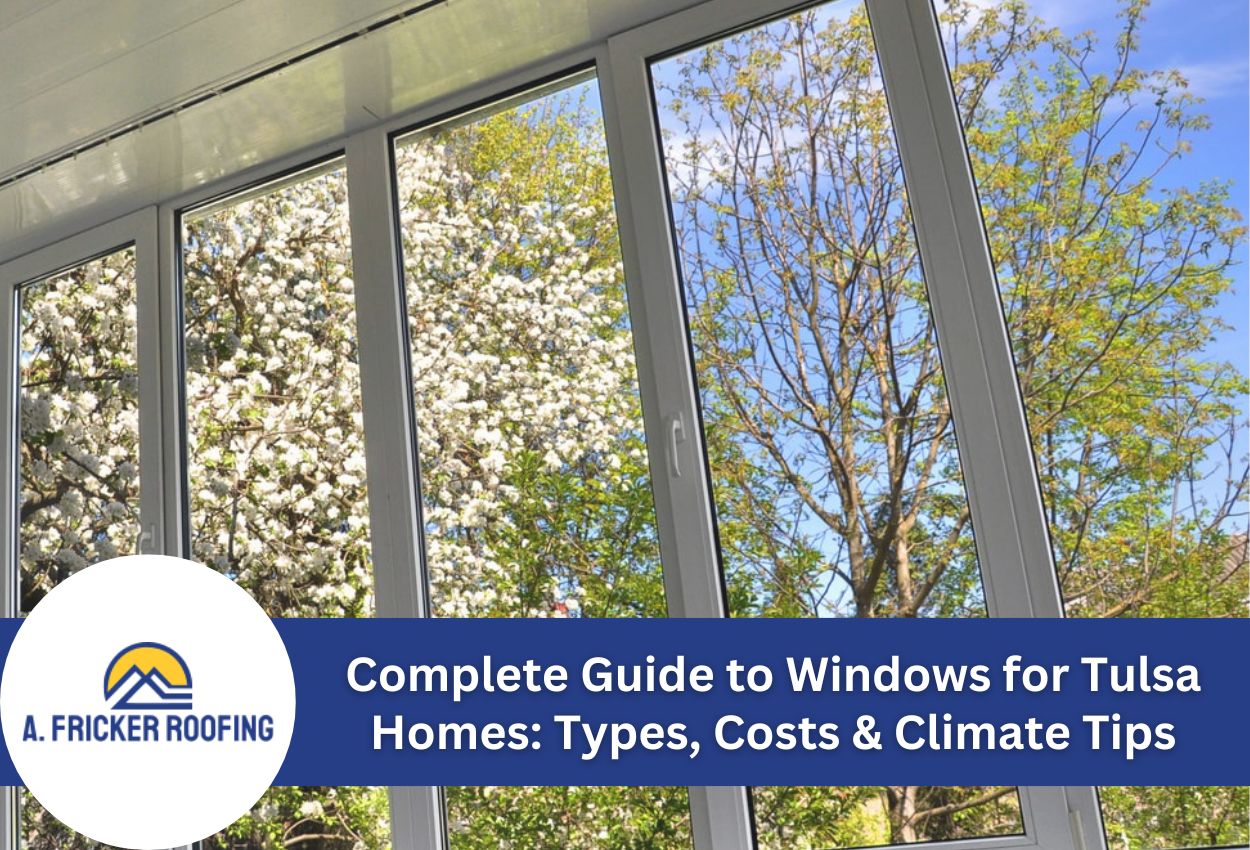 Modern window view with flowering trees under a blue sky.