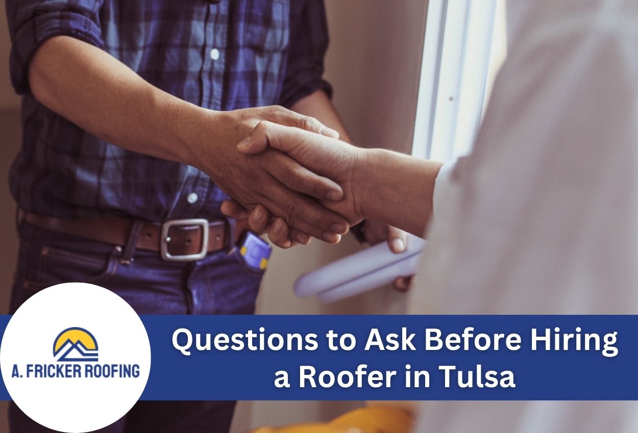 Handshake between a homeowner and roofer discussing roofing services in Tulsa.